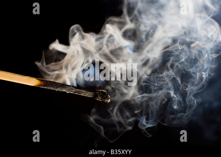 Smoldering match that has just been extinguished. Stock Photo