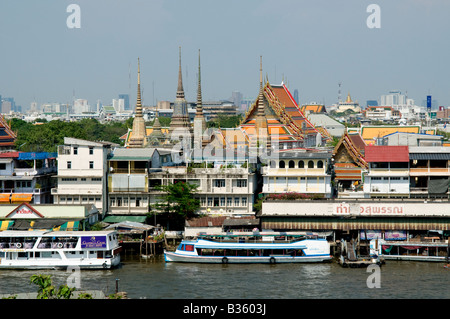 Wat Pho temple and surrounding city area of Bangkok from across the Chao Phraya river Bangkok Thailand Stock Photo