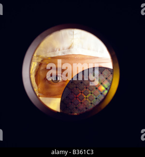 Female holding silicon wafer used in the fabrication of micro computer chips Stock Photo