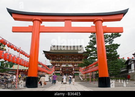 Large torii gate stands at the main entrance to the business and agriculture shrine Fushimi Inari Taisha in Kyoto Stock Photo