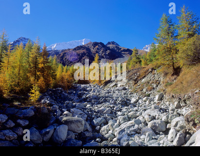 dry bed of mountain creek near settlement of arolla arolla valley swiss alpes canton of valais switzerland Stock Photo