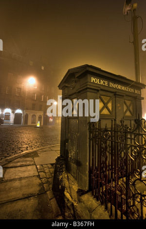 A police box on a foggy night in the Grassmarket, Edinburgh Stock Photo