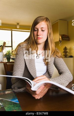Student studying at table indoors Stock Photo - Alamy