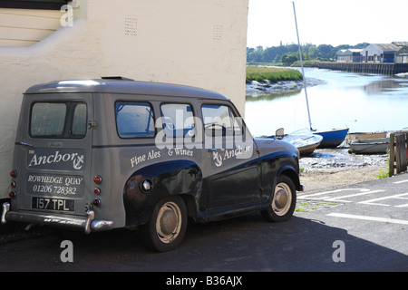 Old Austin Shooting Brake parked outside and advertising The Anchor Pub overlooking River Colne at Rowhedge in Essex, England Stock Photo