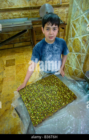 Boy Working in a Bakery in the Old City of Aleppo Syria Stock Photo
