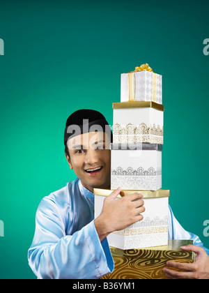 Malay man celebrating hari raya the month after ramadan Stock Photo - Alamy