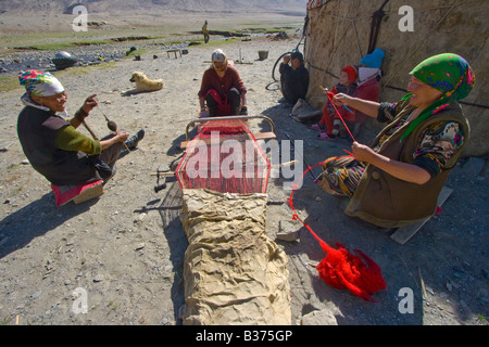 Weaving Handmade Rugs for their Yurt in Jalang Village in the Pamirs in Tajikistan Stock Photo