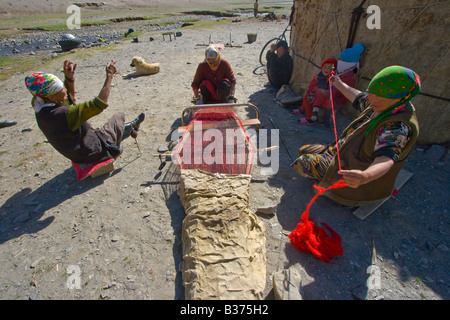 Weaving Handmade Rugs for their Yurt in Jalang Village in the Pamirs in Tajikistan Stock Photo