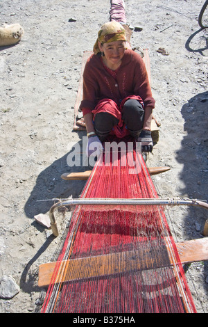 Weaving Handmade Rugs for their Yurt in Jalang Village in the Pamirs in Tajikistan Stock Photo