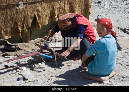 Weaving Handmade Rugs for their Yurt in Jalang Village in the Pamirs in Tajikistan Stock Photo