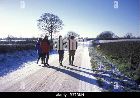 Walking down country lane in winter, Cheshire, UK Stock Photo