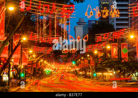 Singapore Christmas light up on Orchard Road the major shopping street with streaks of red tail lights of cars Stock Photo