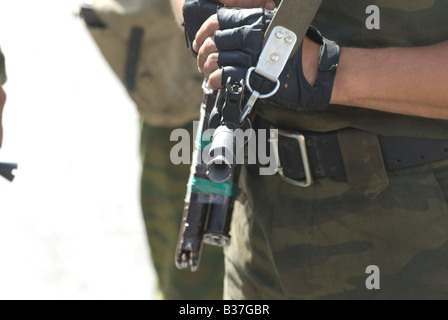 A Russian soldier holds a Kalashnikov ak-47 rifle