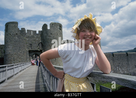 A young girl dressed in traditional clothing at Caerphilly Castle in Wales Stock Photo