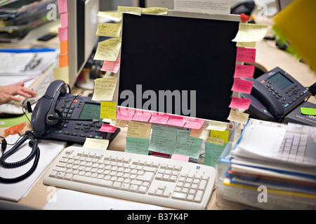 Busy desktop at the call centre office Stock Photo
