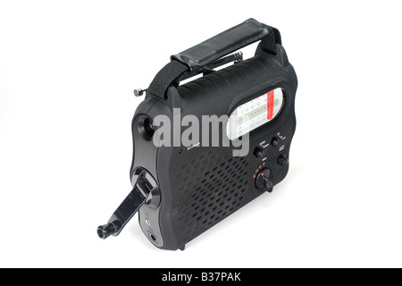Crank powered radio + flashlight (torch) works without batteries in an emergency. It can also be used to charge cell phones. Stock Photo