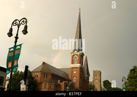 North Adams is the home of Mass MoCA and many church spires and a rainbow on a summer afternoon Stock Photo