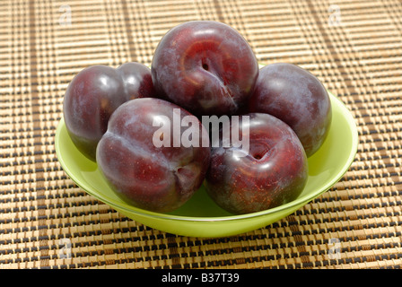 Plums in Plate Stock Photo