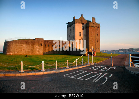 Broughty Ferry Castle, Tayside, Scotland, - taken in evening light with a 'keep clear' notice on the road in the foreground. Stock Photo