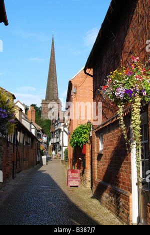 Narrow lane and Parish Church of St.Michaels, Church Lane, Ledbury, Herefordshire, England, United Kingdom Stock Photo