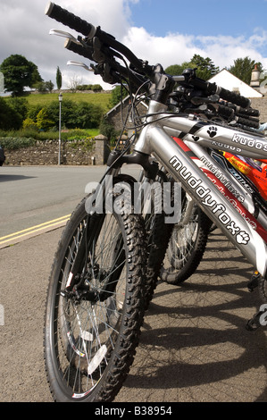 Mountain bikes for hire in a line England UK United Kingdom GB Great Britain Stock Photo