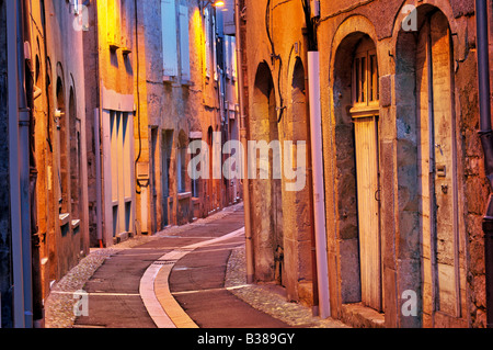 Nightly iluminated medieval alley in St. Cere, France Stock Photo