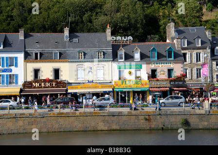 Colourful shop fronts on the harbour front at Binic a popular tourist resort in northern Brittany, France Stock Photo