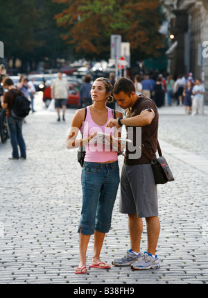 Aug 2008 - Tourist in the Old Town Square looking at a map Prague Czech Republic Stock Photo