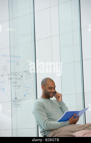African businessman talking on cell phone Stock Photo
