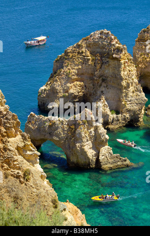 Portugal. the Algarve near Lagos. Ponta da Piedade,  tourist boats visiting the grottos Stock Photo