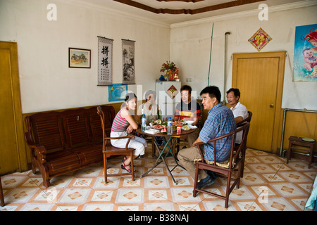 Modern Chinese peasant family eating meal Datianzhuang village, Juyang County, Sanhe City, Hebei Province, Beijing China JMH3172 Stock Photo