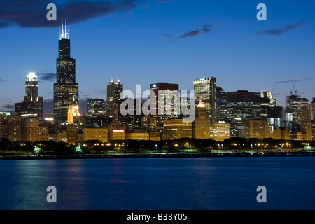 Chicago Illinois Skyline, Early Evening.  Sears Tower (Willis Tower) on Left, Lake Michigan in Foreground. Stock Photo