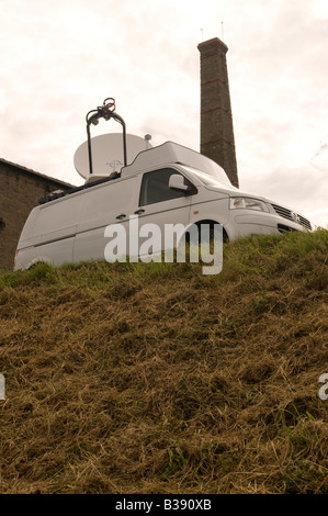An uplink satellite dish mounted on roof of a vehicle used for fast response news coverage Stock Photo