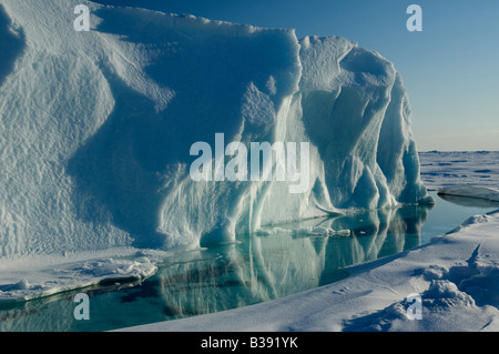 An Iceberg on Cobourg Island in the Canadian Arctic melting in the sunlight. Stock Photo