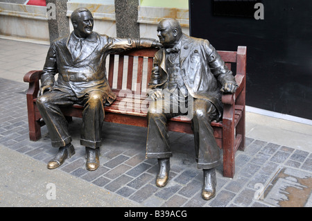 Close up of statue commemorating Winston Churchill meeting Franklin D Roosevelt on bench seat in New Bond Street Mayfair West End London England UK Stock Photo