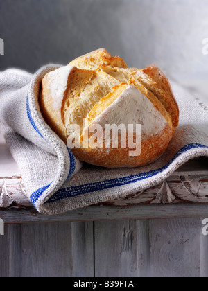 Artisan white bread loaf -  Pain Au Levain bread in a rustic setting Stock Photo