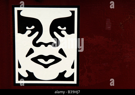obey giant design shepard fairey american usa sticker art red face graphic illustration Stock Photo