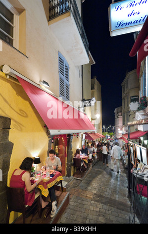 Restaurant on the Rue du Suquet in the old town (Le Suquet) at night, Cannes, Cote d'Azur, Provence, France Stock Photo