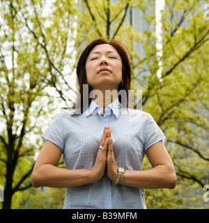 Asian woman meditating Stock Photo