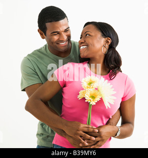 Portrait of smiling African American couple standing looking at each other Stock Photo