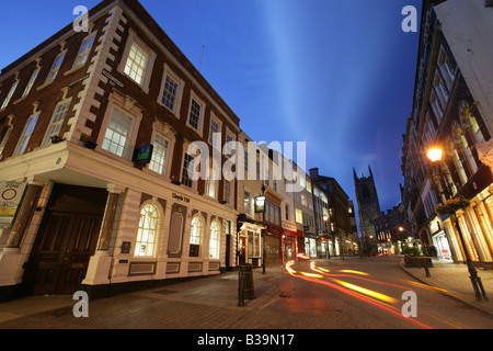 City of Derby, England. Night view Iron Gate properties and architecture, with Derby All Saints’ Cathedral in the background. Stock Photo