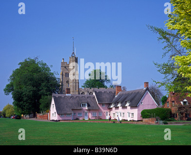 Pink cottages and village church, Cavendish, Suffolk, UK Stock Photo