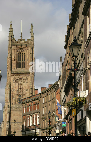 City of Derby, England. Iron Gate west façade properties and architecture, with Derby All Saints’ Cathedral in the background. Stock Photo