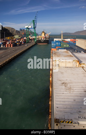 A container ship approaches the dock as seen from it's bridge at Lyttelton, New Zealand Stock Photo