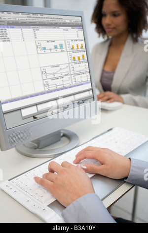 Businesswoman typing on laptop Stock Photo