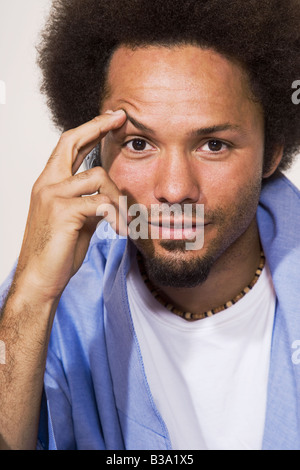 African man with hand on face Stock Photo