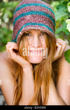 Portrait of pretty caucasian redhead wearing hat Stock Photo