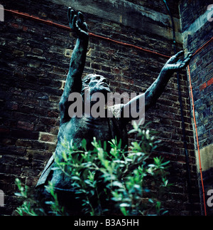 Statue of Jesus being raised from the dead by the sculptor Hans Feibusch. St. Alban the Martyr Church in Holborn, London Stock Photo