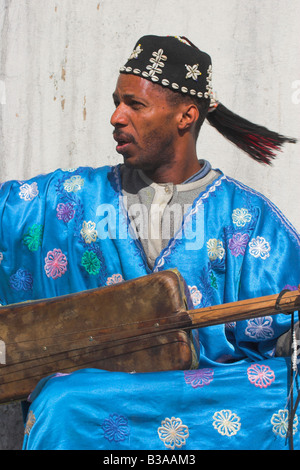 Morocco, Marrrakesh, Old City, Medina, A whirling dirvish playes instrument Stock Photo