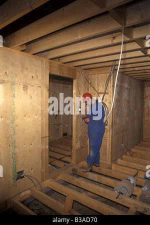 Electrician wiring a new house Stock Photo - Alamy